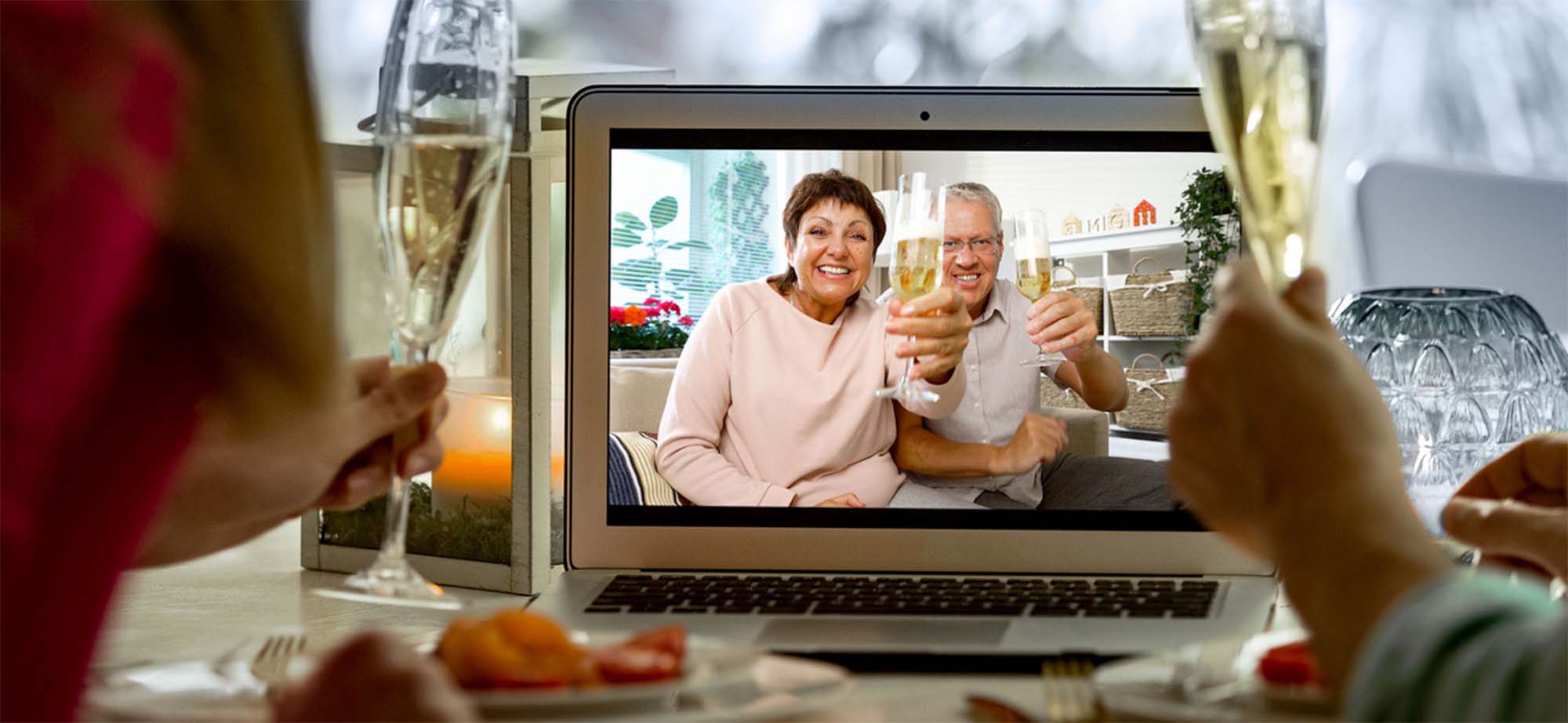 Sparkling wine is toasted at a private online meeting.
